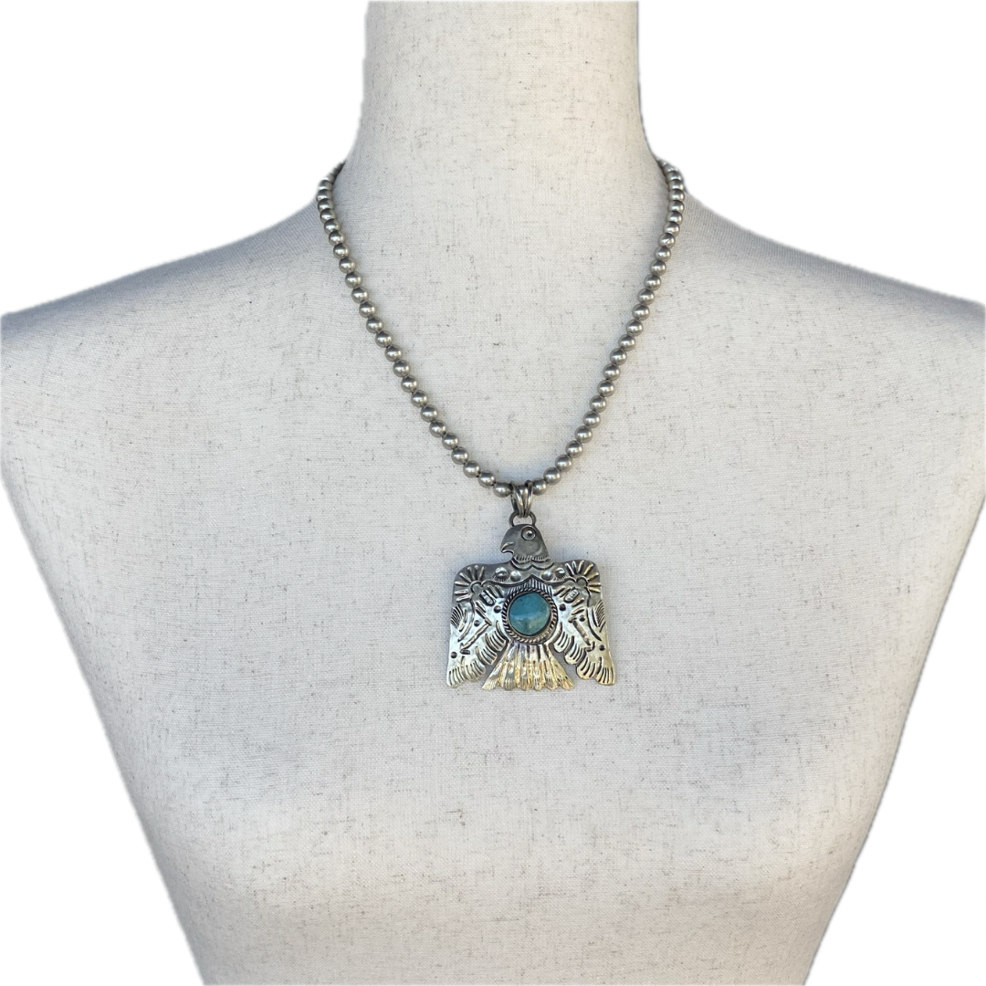 Turquoise Thunderbird on Silver Pearls