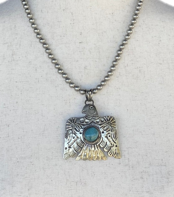 Turquoise Thunderbird on Silver Pearls